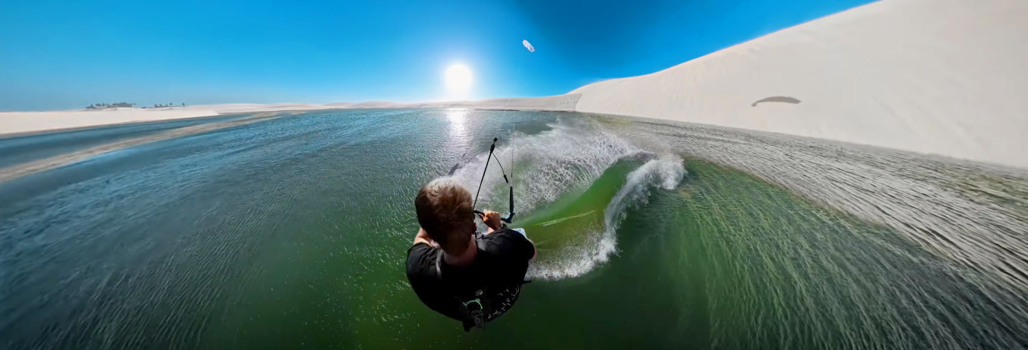 Nick touches down at the bottom of the dune and rides away like it's any other jump. Nick lands safely and rides off.