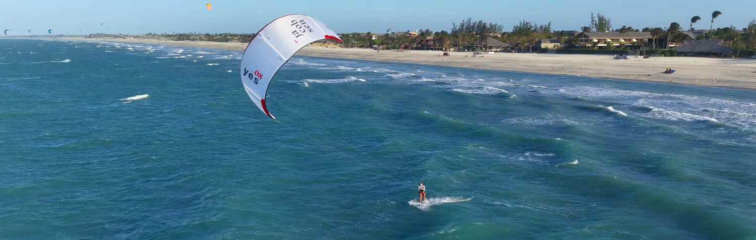 The Yes is a 3-strut do-it-all kite, and a 5-strut is on the way. A kiteboarder rides with the Jacobsen Yes kite.