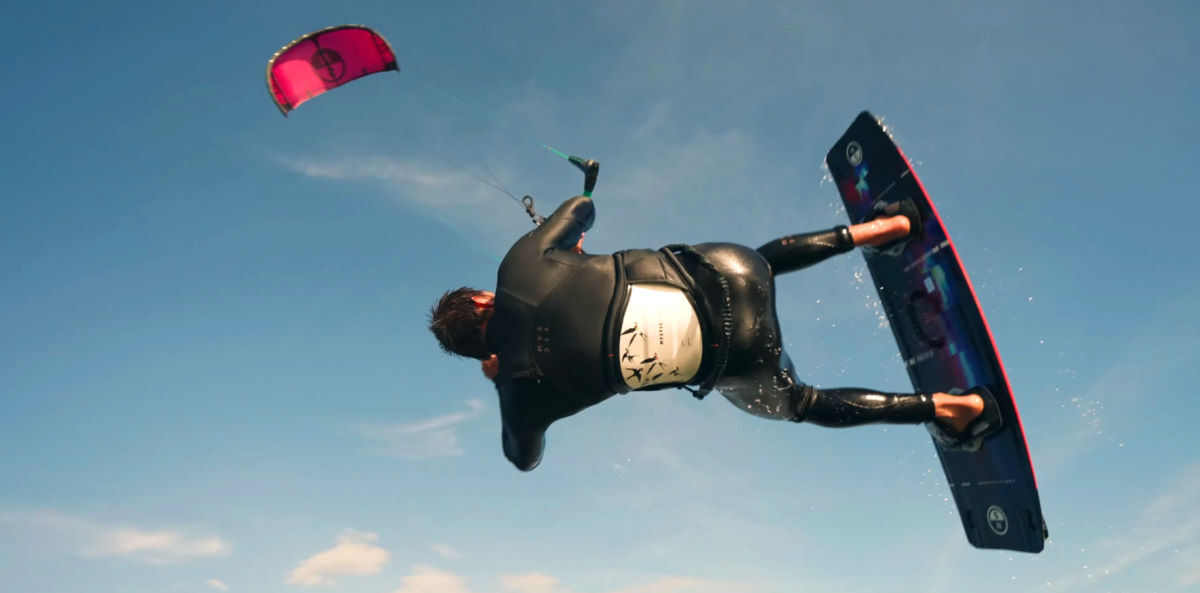 A kiteboarder jumps with the North Reach kite.