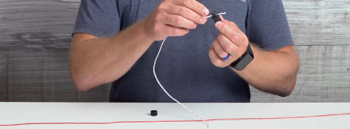 Slide the line through the small hole and replace the cap. installing a high-v kiteboarding adapter