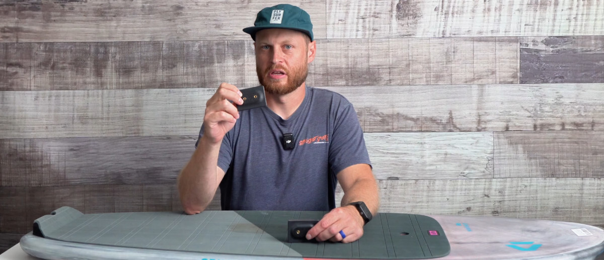 NSI strap inserts can make footstraps an option on nearly any board. Ryan holds up an NSI stick-on strap insert