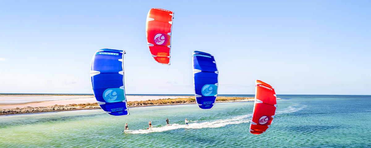 Four kiteboarders ride the Switchblade together.