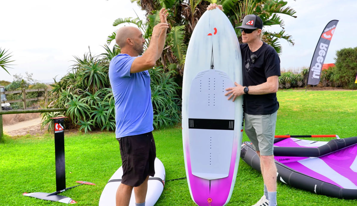 Damien and Jeff stand next to one of the smaller wing package foilboards.