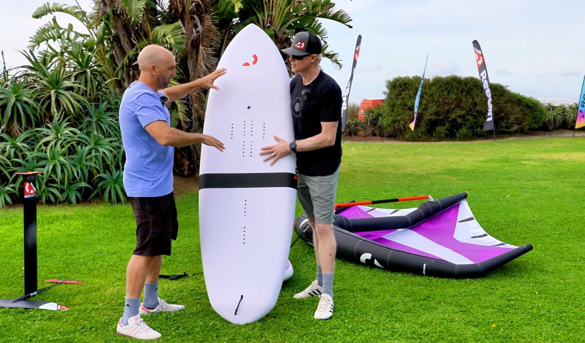 Damien and Jeff stand next to the 138 liter foilboard.