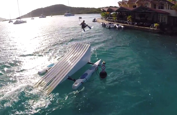 Kiteboarder Riding Off A Water Ramp