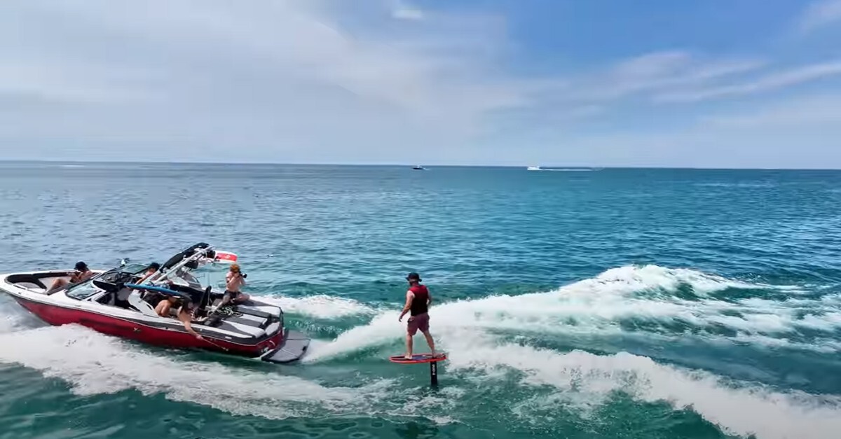 Wake foiling behind a boat in the ocean