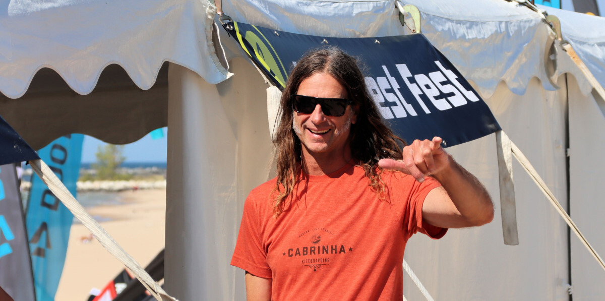 Cabrinha is another brand Marc likes. Marc greeting the camera in an orange Cabrinha shirt
