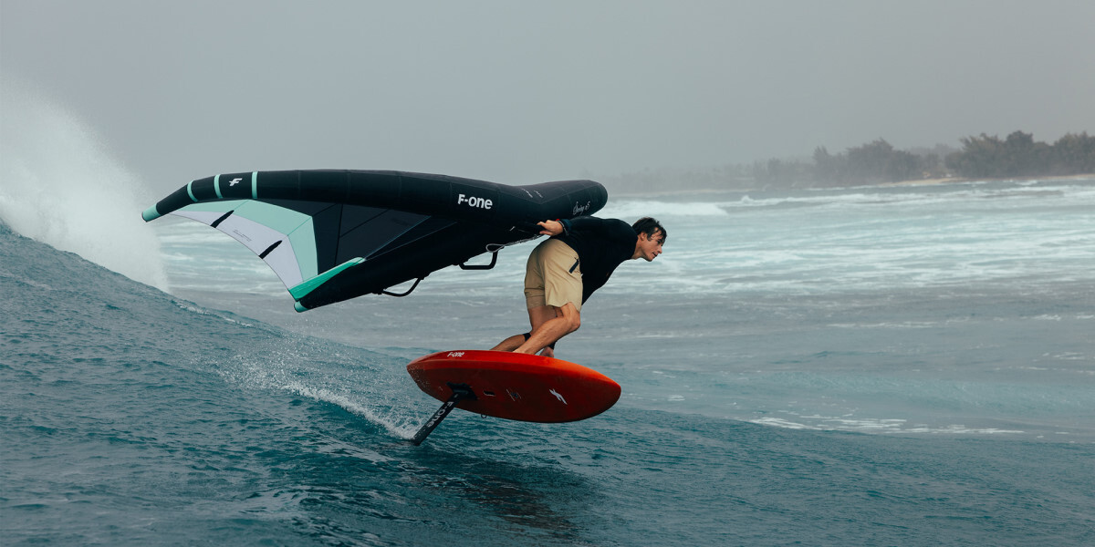 Putting the wing behind your back will add a little style. Riding a wave with the wing behind the back