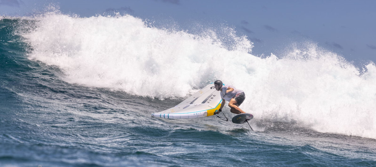 How low can you go? A wing foiling riding a wave